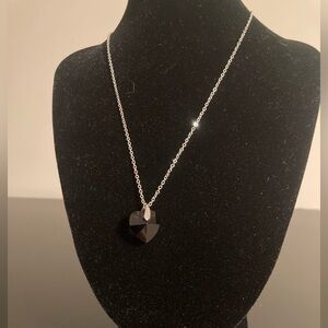 Crystal Colors made w/ Swarovski crystals. Very dark blue heart shaped necklace
